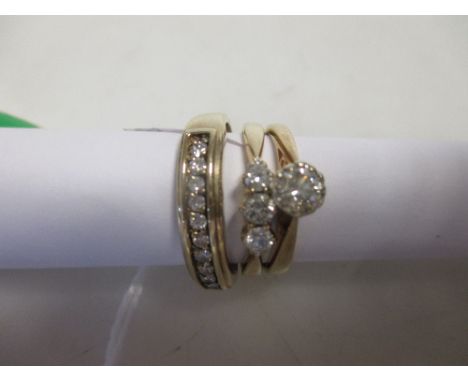A single stone diamond ring 9ct London convention marked stamped DIA 0.25ct, a three stone diamond ring 9ct Birmingham conven