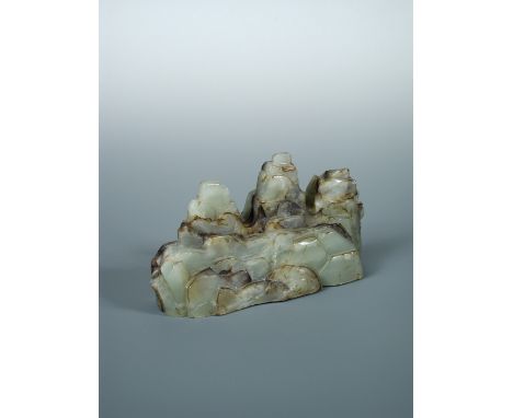 A Chinese jade three peak mountain brush rest, 21cm (8.25 in) wide  