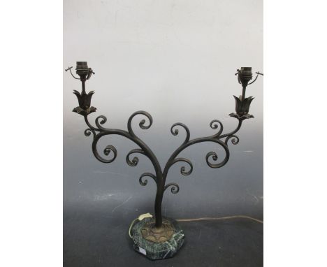An Art Nouveau style twin-branched bronzed lamp on marble base  