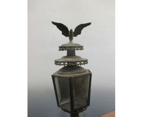 A Continental copper framed coaching lamp with a wall mounting bracket, 75cm high  