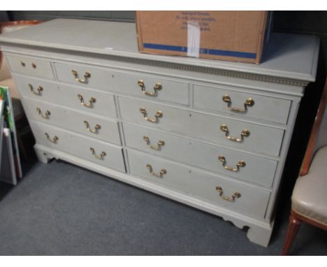 A blue painted bank of drawers on bracket feet 88 x 164 x 51cm  