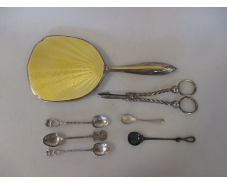 A silver and yellow enamel hand mirror, Birmingham 1935, a silver salt spoon, four Eastern metal spoons and a pair of EPNS gr