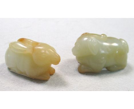 A Chinese nephrite jade hare and a Buddhist lion pup, the hare 4.5cm (1.75 in) wide and the pup, 5cm (2 in) wide (2)  