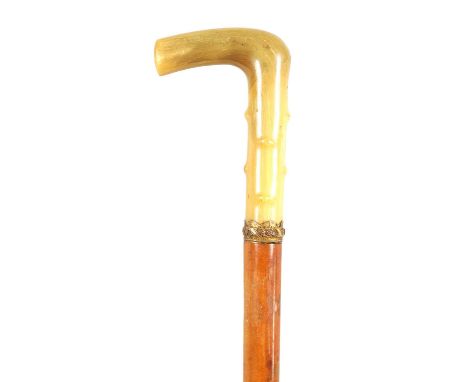 A LATE 19TH CENTURY RHINOCEROS HORN HANDLED SWORD STICK the horn handle formed to simulate hawthorn with gilt collar and push