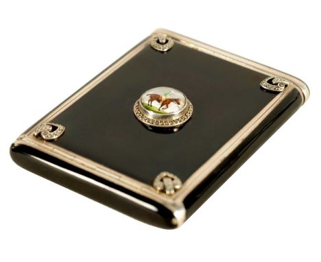 A LATE 19TH/EARLY 20TH CENTURY SILVER AND BLACK ENAMEL LADIES CIGARETTE CASE with sprung end and hinged top enclosing a gilde