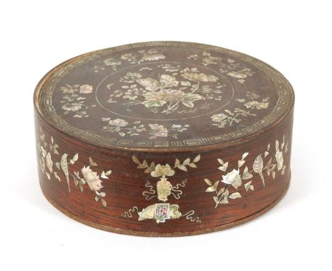 A 19TH CENTURY CHINESE HARDWOOD AND MOTHER OF PEARL INLAID CIRCULAR BOX OF LARGE SIZE the lift-off top and inner border profu
