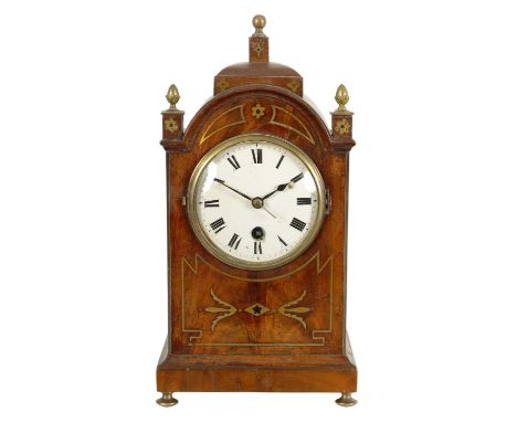 A REGENCY BRASS INLAID FIGURED MAHOGANY MANTEL CLOCK OF SMALL SIZE the 4" enamelled Roman dial fronting an eight day timepiec