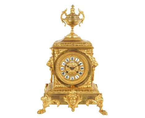 RICHOND. A LATE 19TH CENTURY FRENCH ORMOLU MANTEL CLOCK the ornate case surmounted by an urn finial above a square bodied cas