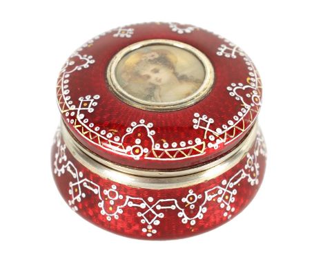 A 19TH CENTURY FRENCH SILVER AND GUILLOCHE ENAMEL CIRCULAR BOX of squat flared form, the red silver mounted body embellished 