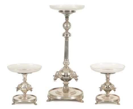 A 19TH CENTURY SILVER PLATED THREE PIECE GARNITURE EPERGNE the tall centrepiece with etched glass top above a reeded column a