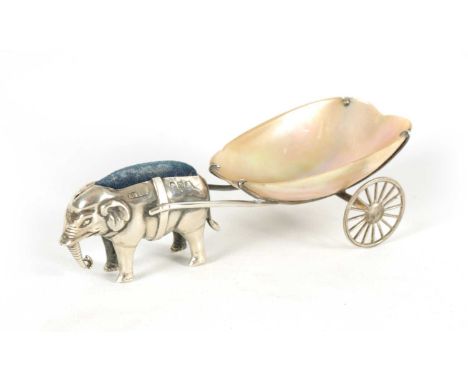 A RARE EDWARD VII SILVER PIN CUSHION IN THE FORM OF AN ELEPHANT PULLING A MOTHER OF PEARL CART by Adie and Lovekin, Birmingha