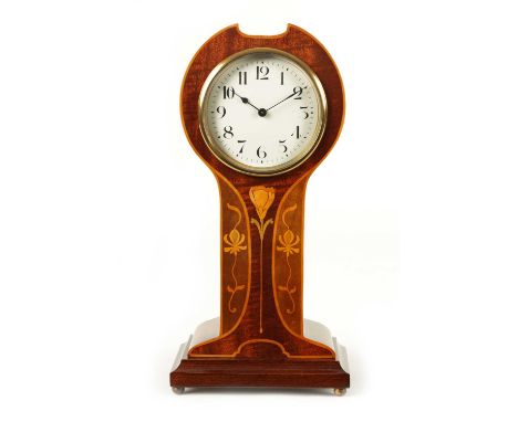 AN EDWARDIAN ART NOUVEAU STYLE BOXWOOD STRUNG AND MAHOGANY INLAID MANTEL CLOCK the enamel Arabic dial fronting an eight-day s