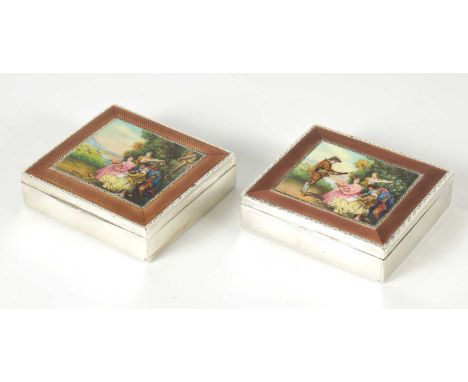 A PAIR EARLY 20TH CENTURY CONTINENTAL SILVER AND ENAMEL TABLE CIGARETTE BOXES the lids with handpainted musical figural scene