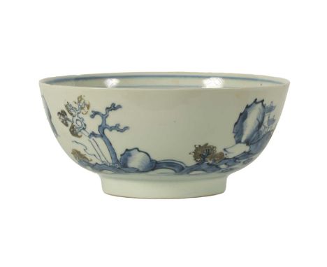 AN 18TH CENTURY CHINESE BLUE AND WHITE FOOTED BOWL FROM THE NANKING CARGO decorated with tree-lined landscape and pagoda hous