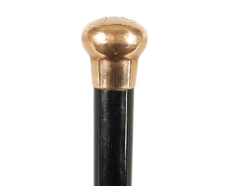 A LATE 19TH CENTURY 9CT GOLD HANDLED WALKING STICK with ebonised tapering shaft - hallmarked .37589.5cm overall