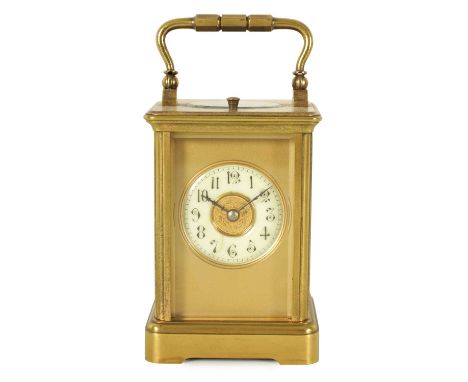 A LATE 19TH CENTURY FRENCH EIGHT-DAY REPEATING BRASS CASED CARRIAGE CLOCK the masked dial with Arabic numerals fronting an ei