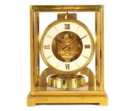 A 1960'S JAEGER-LECOULTRE ATMOS CLOCK the glazed gilt case with canted corners enclosing a skeletonised white dial with gilt 