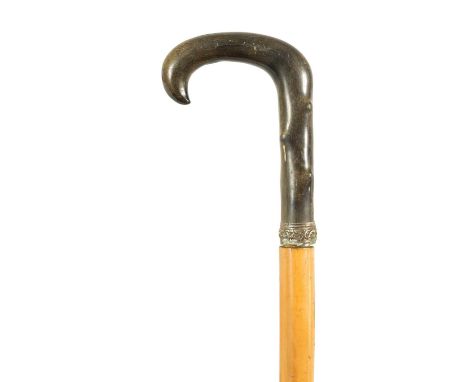 A LATE 19TH CENTURY RHINOCEROS HORN HANDLED SWORD STICK the horn handle carved to simulate hawthorn with silver collar and pu