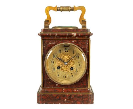 A 19TH CENTURY GILT BRASS AND ROUGE MARBLE MANTEL CLOCK with folding handle enclosing a silvered combined thermometer and com