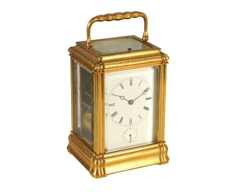A LATE 19TH CENTURY FRENCH GILT BRASS GORGE-CASED REPEATING CARRIAGE CLOCK the white enamel dial with Roman chapter ring abov