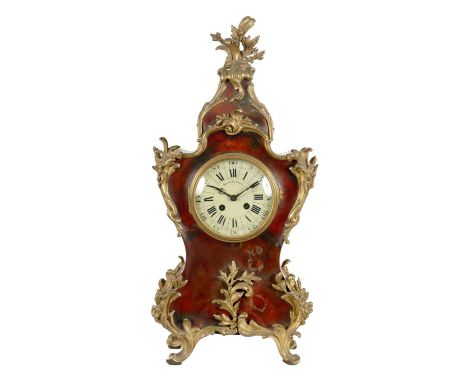 A MID 19TH CENTURY FRENCH ORMOLU MOUNTED TORTOISESHELL VENEERED ROCOCO STYLE MANTEL CLOCK the 5" cushion-shaped enamel dial w