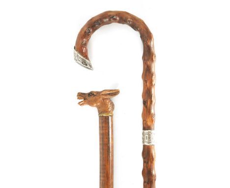 TWO EARLY 20TH CENTURY WALKING STICKS comprising a silver mounted crook handled hawthorn stick together with a walking cane w