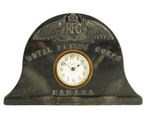 A ROYAL FLYING CORPS MANTEL CLOCK the arched pewter case with RFC winged emblem inscribed below 'ROYAL FLYING CORPS, CANADA' 
