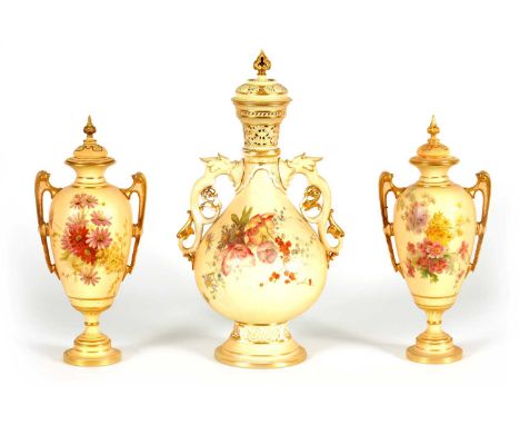 AN ORNATE ROYAL WORCESTER GILT AND IVORY GROUND SCROLLED TWO-HANDLED CABINET VASE AND COVER of bulbous footed form with pierc