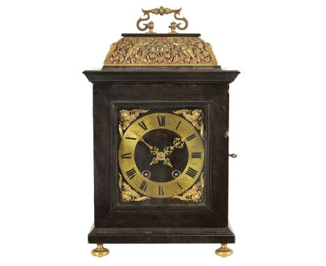 A 17TH CENTURY STYLE CONTINENTAL EBONY VENEERED AND GILT BRASS MOUNTED BASKET TOP BRACKET CLOCK the 7" square fabric backed g