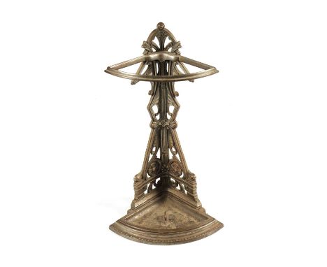 A LATE 19TH CENTURY FALKIRK AESTHETIC CAST IRON CORNER STICK/UMBRELLA STAND with bowed tray base and cut-out sides depicting 