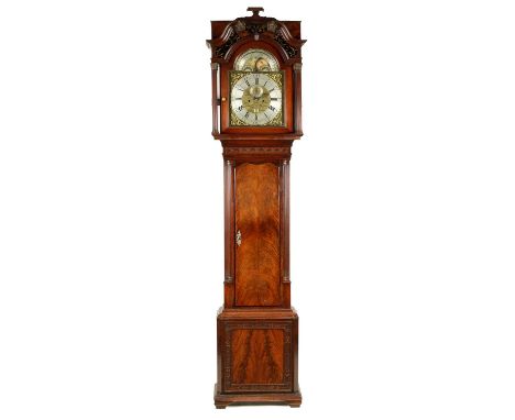 WILLIAM WINSTANLEY, WIGAN. A GEORGE III FLAME MAHOGANY EIGHT-DAY MOON ROLLER LONGCASE CLOCK the 13" brass arched dial with ro