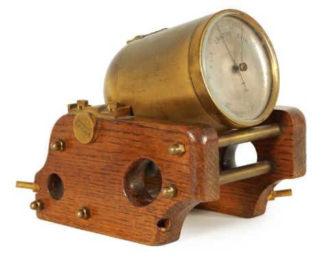 A 19TH CENTURY GILT BRASS AND OAK NOVELTY DESK BAROMETER SIGNED W. THORN, 4 PALL MALL. Modelled as a mortar cannon with gilt 