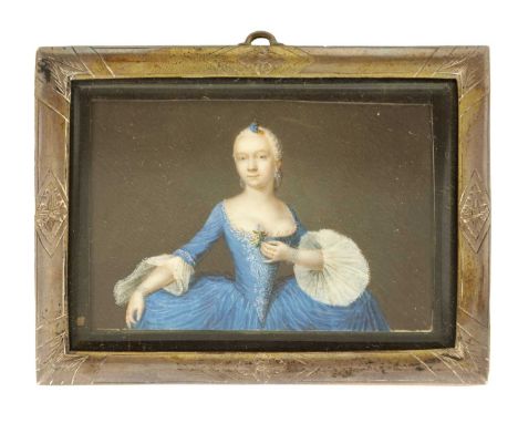 AN 18TH CENTURY CONTINENTAL MINIATURE HALF LENGTH PORTRAIT OF A LADY in blue dress - mounted in an engraved silvered metal fr