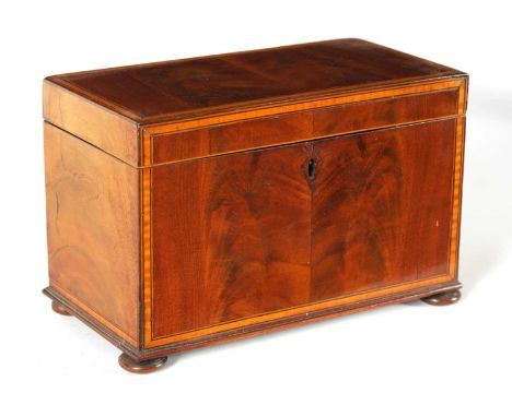 A GEORGE III SATINWOOD STRUNG AND EBONY LINED FIGURED MAHOGANY TEA CADDY the hinged lid enclosing a divided interior with sat