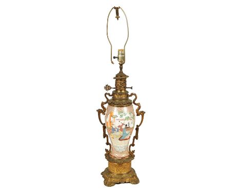 A 19TH CENTURY CHINESE FAMILLE ROSE VASE LAMP with ormolu mounted oil lamp and figural scene to the body56cm high 