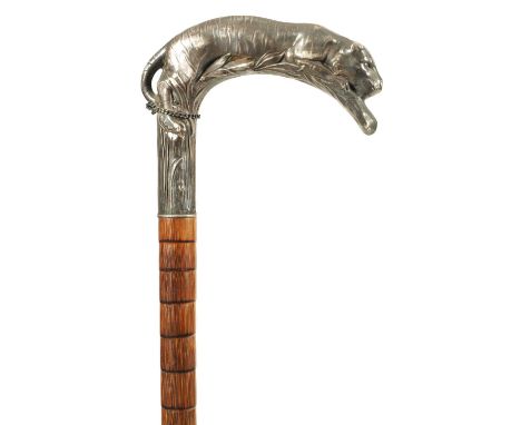 A LATE 19TH CENTURY FRENCH ART NOUVEAU SILVER MOUNTED PALM WOOD WALKING STICK the handle finely modelled as a crouching tiger