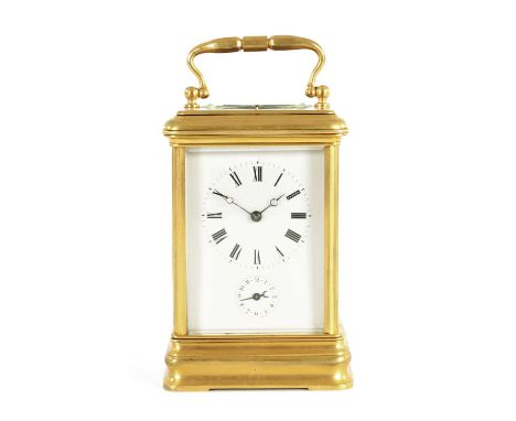 AN UNUSUAL LATE 19TH CENTURY GILT BRASS GRAND SONNERIE CARRIAGE CLOCK the moulded case with rounded corners and bevelled glas