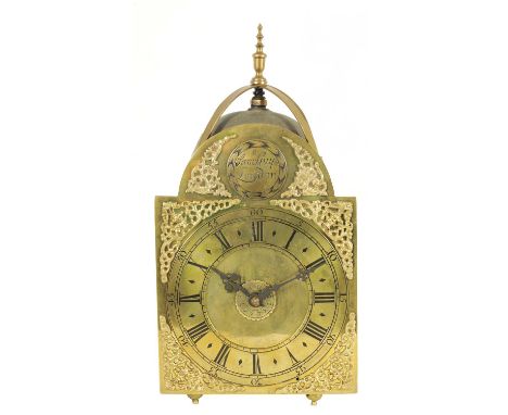 SAMUEL GUY, LONDON. AN EARLY 18TH CENTURY BRASS LANTERN CLOCK the 8" arched dial with Roman chapter ring, inner quarters and 