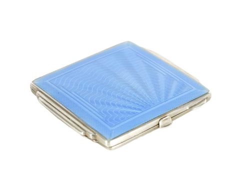 AN ART DECO SILVER AND GUILLOCHE ENAMEL LADIES COMPACT with a wavy fanned design to the top opening to reveal a mirror and po