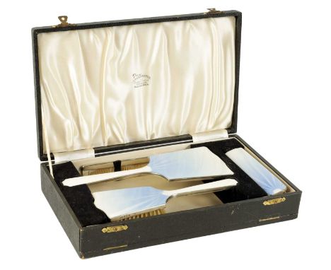 A FINE MID 20TH CENTURY UNUSUAL 4 PIECE SILVER AND GUILLOCHE ENAMEL DRESSING TABLE SET comprising hand mirror, hair brush, cl