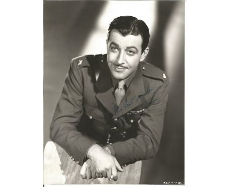 Robert Taylor signed 10 x 8 inch b/w photo in Army uniform. Good Condition. All autographs are genuine hand signed and come w