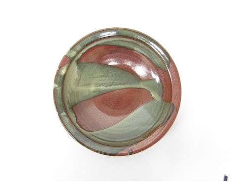 RAY FINCH (1914-2012) A Winchcombe Pottery bowl, brown glaze with a green poured slip detail.  Impressed seal.  27.5cm diamet