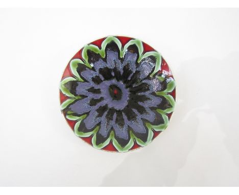 A Poole Delphis plate with green, red and lilac colours 20.5cm diameter 