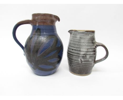A Leach St Ives pottery standard ware jug (no lid) together with a studio pottery jug, unmarked. Tallest 21cm