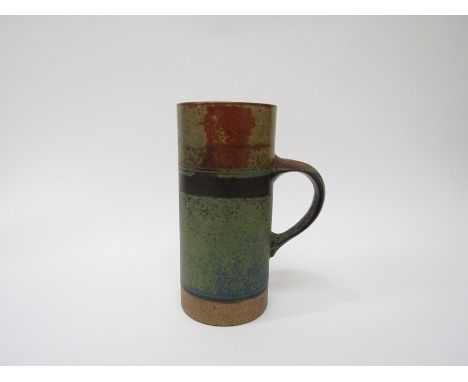 ROBIN WELCH (1936-2019) A studio pottery domestic range tall tankard. Impressed mark. 18cm high