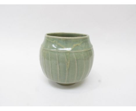 DAVID LEACH (1911-2005) A Studio Porcelain Celadon glazed bowl with cut faceted detail, impressed personal seal. 13cm high x 