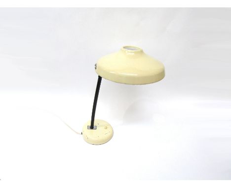 A cream painted metal desk lamp with adjustable shade.