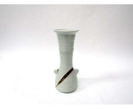 JANET LEACH (1918-1997) (ARR) St Ives Pottery porcelain twin lugged vase. Pale celadon glaze with tenmoku flashes. Impressed 