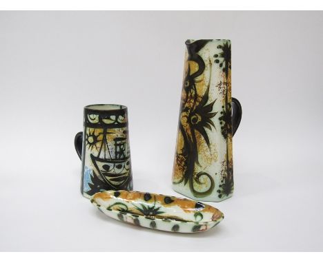 Three pieces of Celtic Pottery of Newlyn, Pheonix jug, 29cm high, painted boat jug, 16.5 cm high and a small dish, 22cm x 9cm