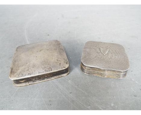 A Dutch silver snuff box with hallmarks for 833 fineness, vacant shield cartouche to the lid and one further snuff box stampe